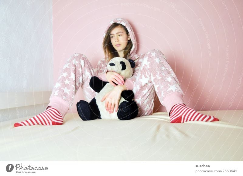 teenager sits somewhat lost on her bed with a cuddly toy in the poor girl Child Young woman 13 - 18 years Youth (Young adults) Puberty 14-year-old Pink