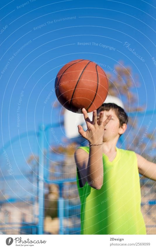 Teenage playing basketball on an outdoors court Lifestyle Joy Relaxation Leisure and hobbies Playing Sports Human being Boy (child) Man Adults Clothing Hat