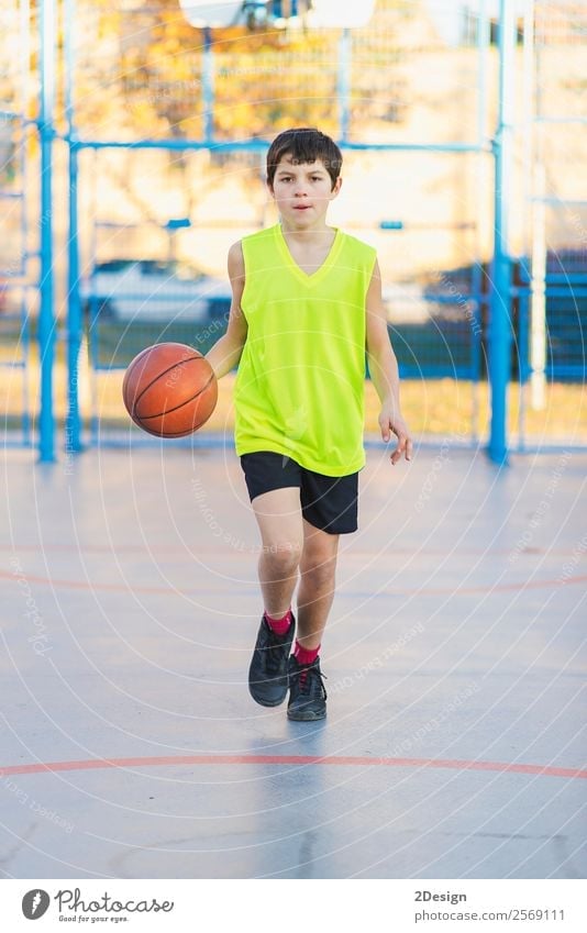 Teenage playing basketball on an outdoors court Lifestyle Joy Relaxation Leisure and hobbies Playing Sports Human being Masculine Boy (child) Man Adults 1