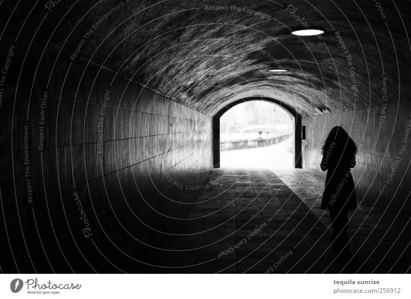 Going into the light Lamp Human being Woman Adults 1 Graffiti Wall (barrier) Wall (building) Handrail Tunnel Tunnel vision Tunnel lighting Pedestrian Dark
