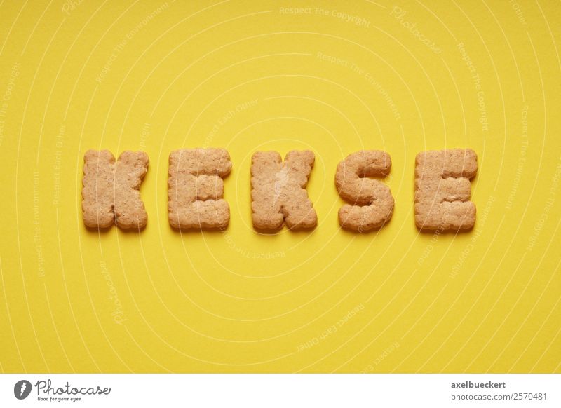 biscuits Food Dough Baked goods Candy Nutrition To have a coffee Yellow Cookie Letters (alphabet) Word Text Bird's-eye view Colour photo Studio shot Deserted