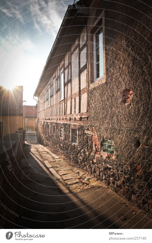 village alley Village Wall (barrier) Wall (building) Window Roof Moody Half-timbered facade Old building Plaster Shadow Village road Alley Clouds in the sky