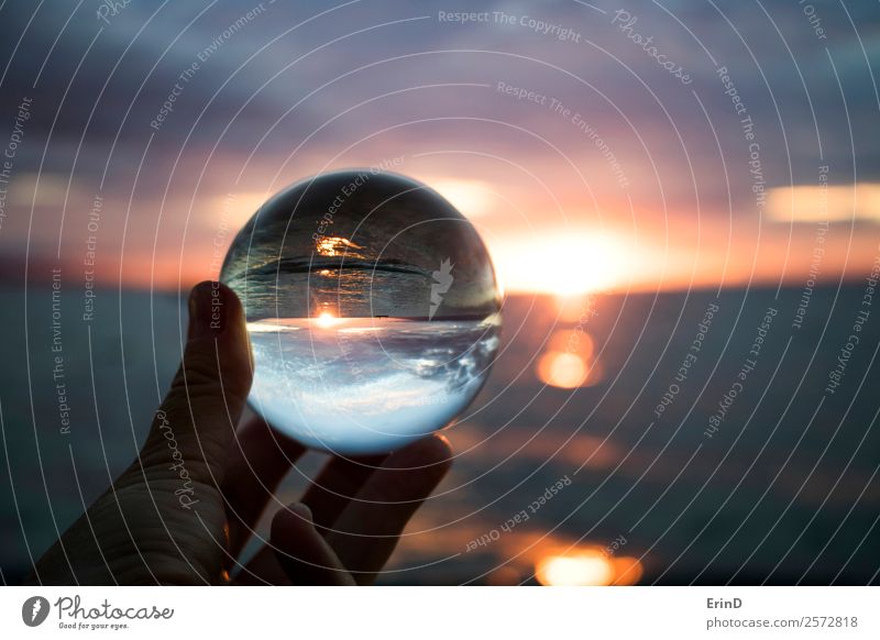 Sunset over Ocean Captured in Glass Ball Beautiful Vacation & Travel Hand Environment Nature Landscape Sky Clouds Horizon Watercraft Sphere Globe Bright Small