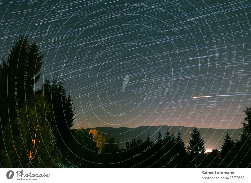 a startrail over the mountains of the Giant Mountains Environment Nature Landscape Sky Night sky Stars Park Dark stars Starry sky Mars Colour photo