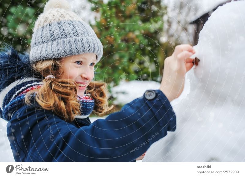 Cute Happy Little Boy and Girl Making Snowman on Christmas Holiday