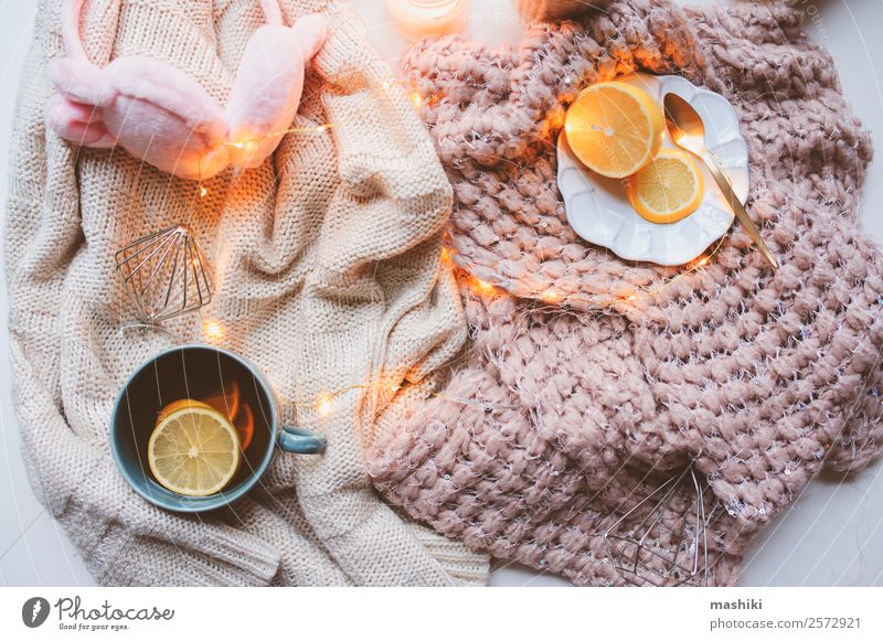 Cozy winter still life. Stylish cup of tea with cozy knitted sweater, pine  cone Stock Photo by Sonyachny