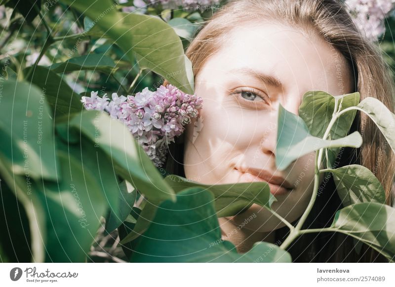 Lifestyle portrait of happy young adult woman enjoying flowers Fresh Park Eyes Leaf Lilac Garden Caucasian pretty Happy Attractive Beauty Photography Hair