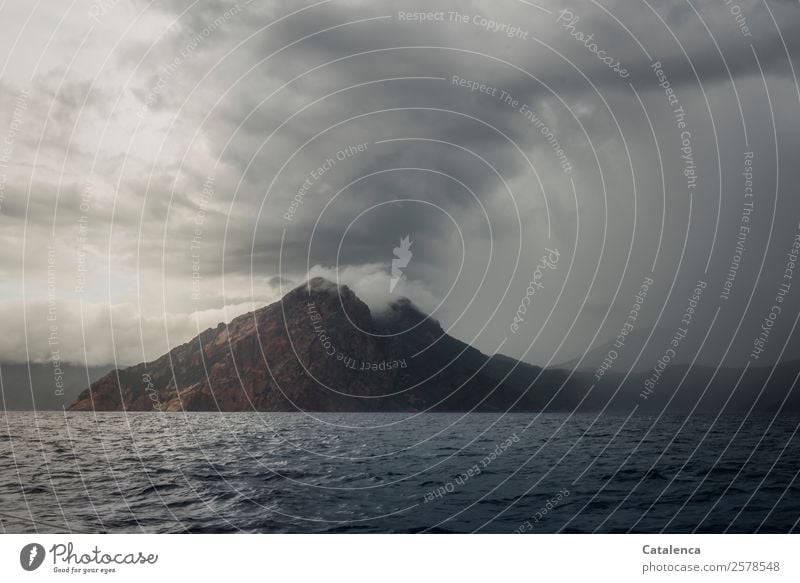 Weather change, a thunderstorm moves up over the sea Landscape Elements Water Clouds Storm clouds Summer Bad weather Fog Rain Rock Mountain coast Ocean