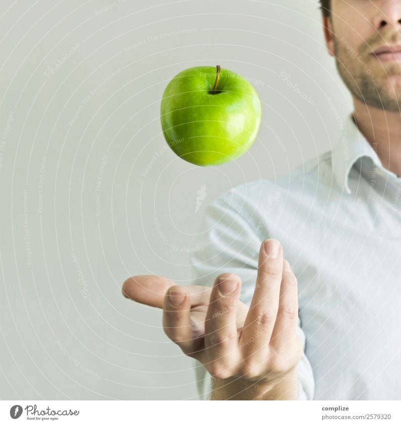 Man juggling with a green apple Food Fruit Apple Nutrition Eating Breakfast Picnic Organic produce Vegetarian diet Diet Joy Happy Healthy Health care