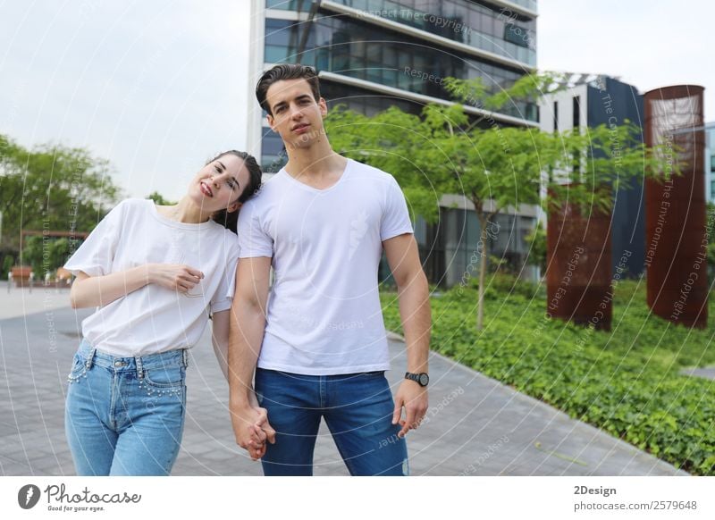 Young beautiful couple posing wearing jeans and t-shirt Lifestyle Style Happy Beautiful Woman Adults Man Friendship Couple 2 Human being 13 - 18 years