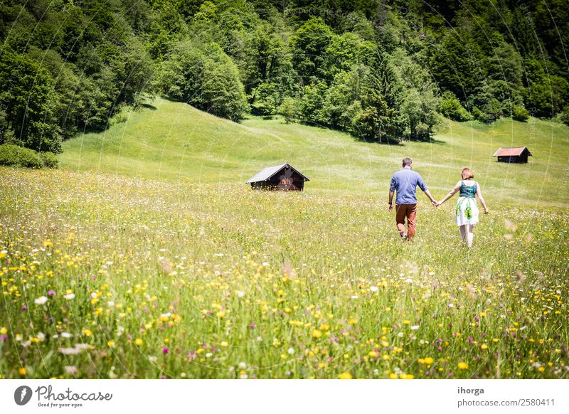 happy lovers on Holiday in the alps mountains Lifestyle Happy Beautiful Relaxation Vacation & Travel Adventure Summer Mountain Woman Adults Man Couple Partner