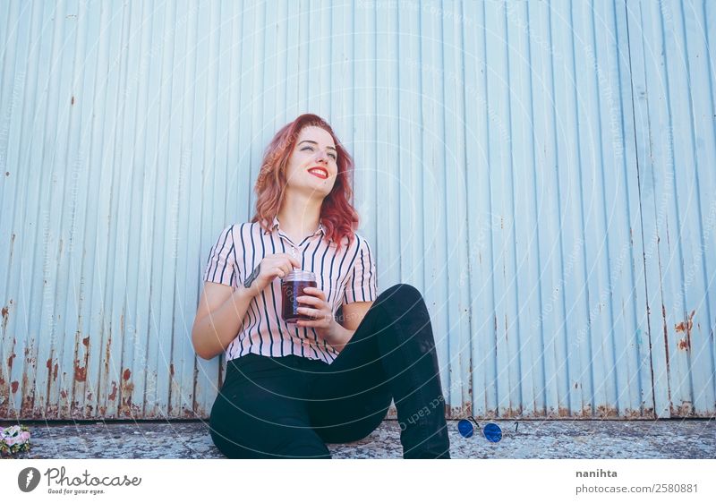 Young happy woman against a blue wall Beverage Cold drink Tea Lifestyle Joy Wellness Well-being Leisure and hobbies Human being Feminine Young woman