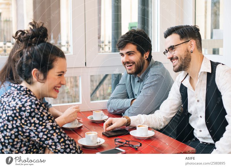 Group of friends having fun Coffee Joy Table To talk Woman Adults Man Friendship Fashion Beard Smiling Laughter Sit Happiness Together Modern Attachment young