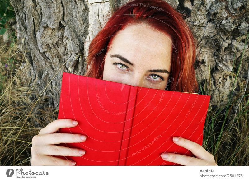 Young redhead woman cover by a book Lifestyle Style Design Beautiful Freckles Wellness Harmonious Senses Leisure and hobbies Education Study