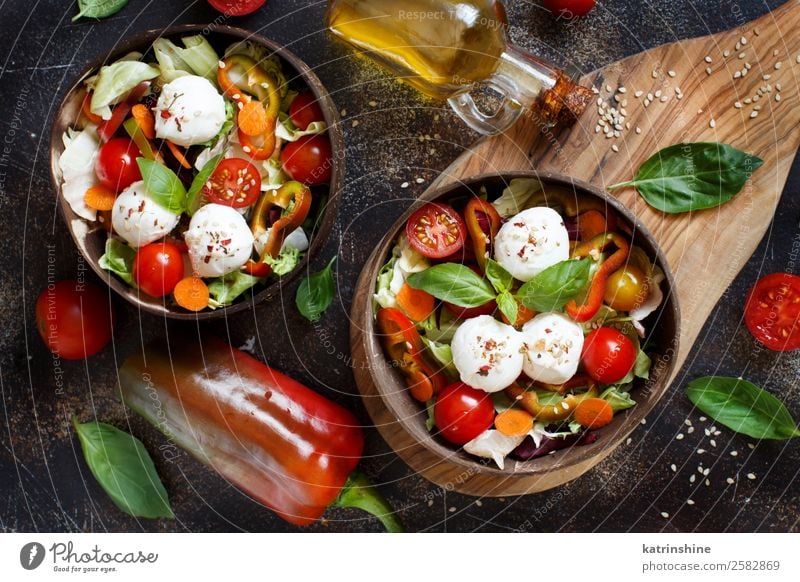 Mixed salad with mozzarella Cheese Vegetable Herbs and spices Eating Lunch Vegetarian diet Diet Bottle Leaf Dark Fresh Green Red appetizer Basil Caprese Cherry