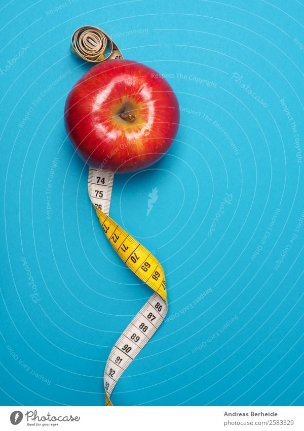 Apple with measuring tape, counting calories, Christmas, diet, losing weight Food Fruit Organic produce Vegetarian diet Diet Fasting Lifestyle Healthy