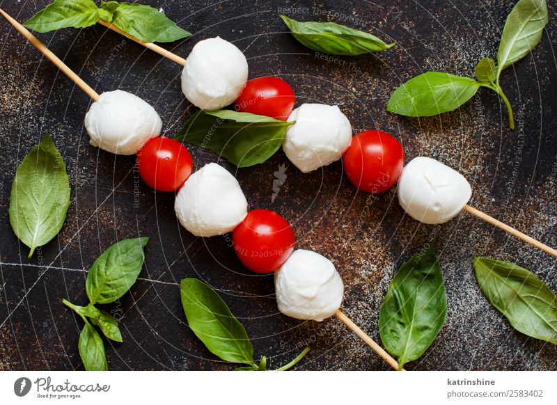 Italian cheese mozzarella with tomatoes and basil Nutrition Vegetarian diet Ball Dark Fresh Bright Delicious Soft Green Red White Tradition Meal mediterranean
