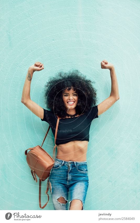 Funny black woman with afro hair raising arms outdoors Lifestyle Style Joy Happy Beautiful Hair and hairstyles Face Human being Feminine Young woman