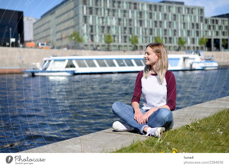 Woman sits at the river Lifestyle Joy Happy Beautiful Contentment Relaxation Leisure and hobbies Tourism Summer Young woman Youth (Young adults) Adults