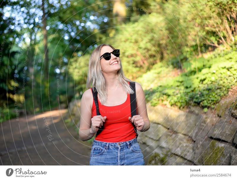 Young woman in the park Lifestyle Joy Happy Beautiful Contentment Relaxation Leisure and hobbies Tourism Summer Hiking University & College student