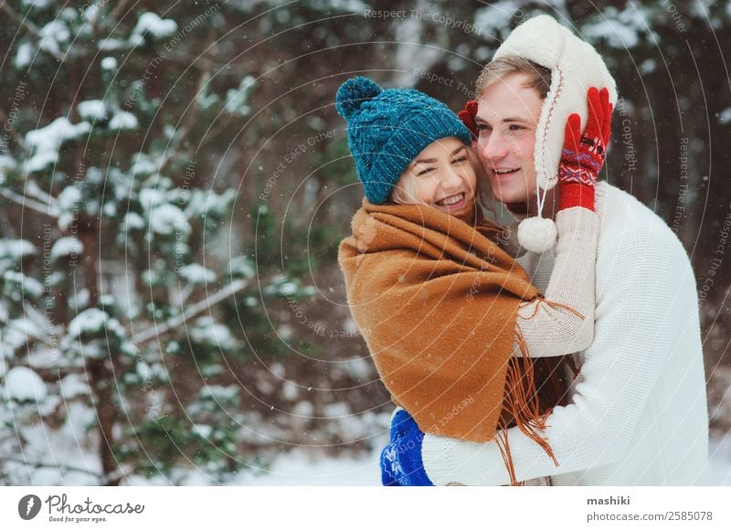 happy young loving couple walking in snowy winter forest Lifestyle Joy Vacation & Travel Adventure Freedom Winter Snow Winter vacation Woman Adults Man Couple