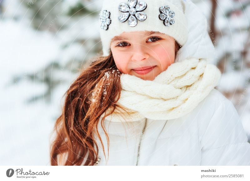 Closeup portrait of cute baby girl posing in winter clothes