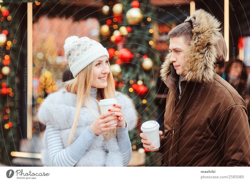 christmas portrait of happy couple with hot mulled wine Tea Mulled wine Shopping Vacation & Travel Winter Decoration New Year's Eve Couple Tree Street Fur coat