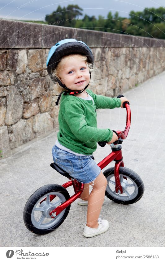 Little kid riding his bike down the street Lifestyle Joy Happy Leisure and hobbies Playing Summer Sports Cycling Child Human being Baby Toddler Boy (child)