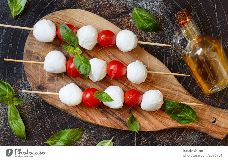 Italian cheese mozzarella with tomatoes, basil and olive oil Nutrition Vegetarian diet Bottle Ball Dark Fresh Bright Delicious Soft Green Red White Tradition