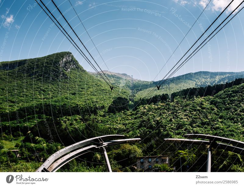 Monte Baldo gondola up the mountain. Nature Landscape Sky Beautiful weather Forest Alps Mountain Passenger traffic Cable car Driving Far-off places Gigantic