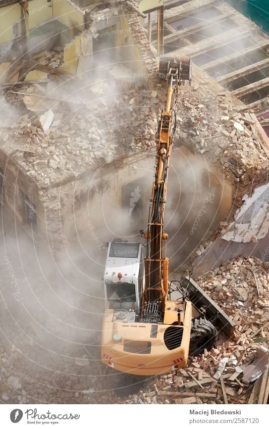 Building demolition with an excavator in dust cloud. House (Residential Structure) Construction site Machinery Ruin Work and employment Death Survive Decline