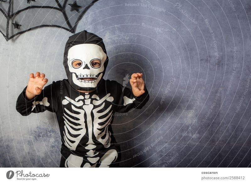 Little kid in a skeleton costume on Halloween Carnival Joy Happy Face Make-up Leisure and hobbies Feasts & Celebrations Hallowe'en Fairs & Carnivals Child