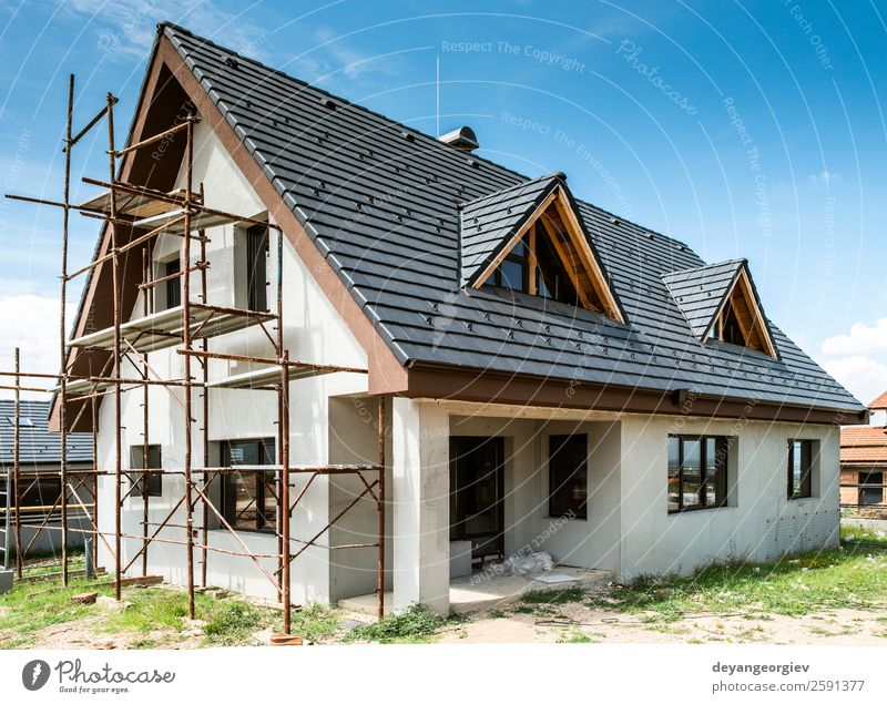 Small new build houses House (Residential Structure) Sky Architecture Facade Build Authentic New Home estate Scaffolding Housing construction roof exterior