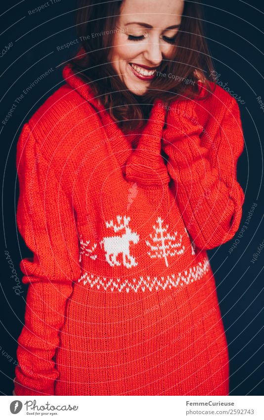 Brunette woman with red deer wool sweater Feminine Woman Adults 1 Human being 18 - 30 years Youth (Young adults) 30 - 45 years Well-being