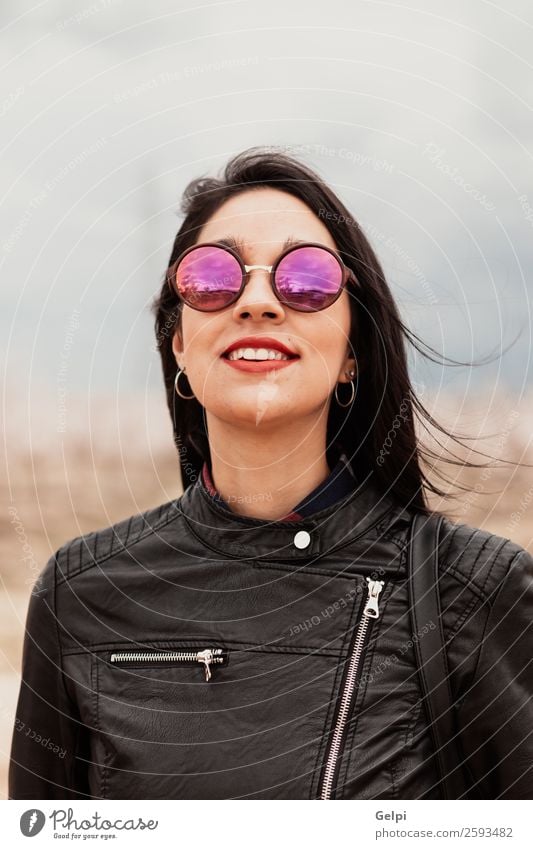 Pretty brunette girl Style Happy Beautiful Face Human being Woman Adults Lips Nature Park Fashion Jacket Leather Sunglasses Brunette Think Smiling Happiness