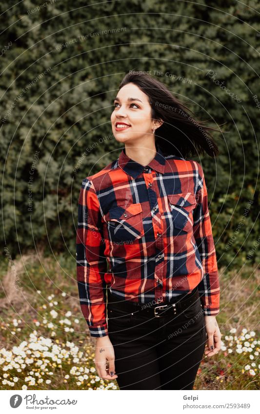 Pretty brunette girl Style Happy Beautiful Face Wellness Human being Woman Adults Lips Nature Flower Park Fashion Jacket Leather Brunette Smiling Happiness Long