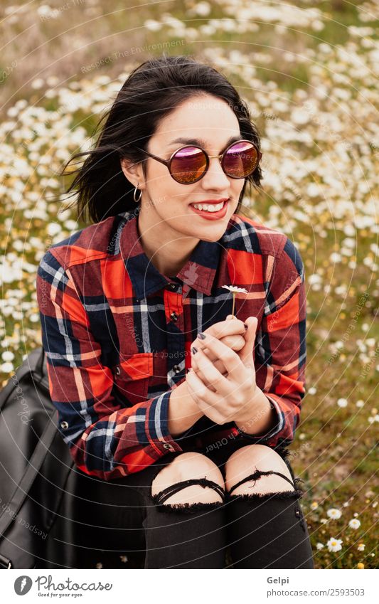 Pretty brunette girl Lifestyle Joy Happy Beautiful Face Wellness Relaxation Human being Woman Adults Nature Sky Flower Grass Blossom Park Meadow Sunglasses