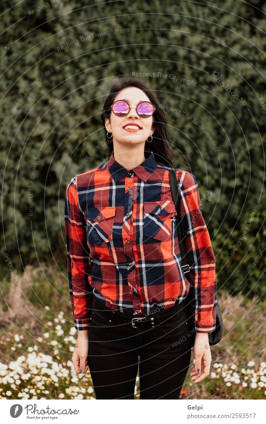 Pretty brunette girl Style Happy Beautiful Face Wellness Human being Woman Adults Lips Nature Flower Park Fashion Jacket Leather Sunglasses Brunette Smiling