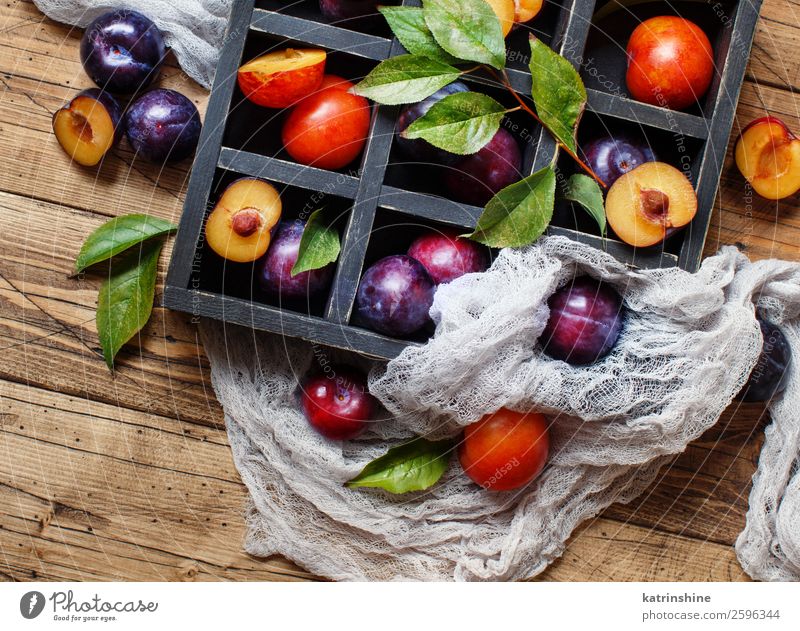 Fresh plums with leaves Fruit Nutrition Vegetarian diet Diet Summer Table Autumn Leaf Wood Juicy Brown Plum Purple Raw Mature agriculture sweet vitamins Rustic