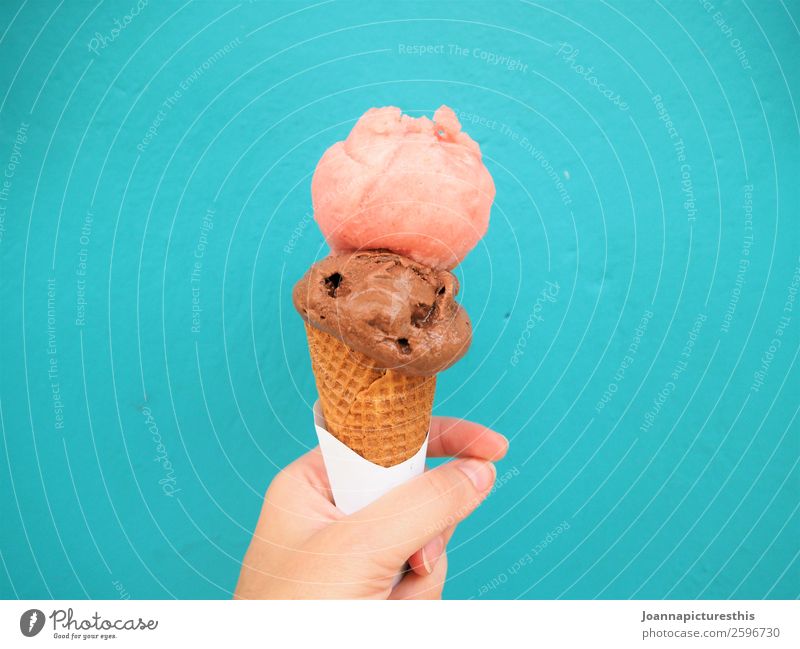 ice cream Food Dessert Ice cream Candy Lifestyle Summer Hand Wall (barrier) Wall (building) Eating To hold on Cold Delicious Multicoloured Pink Turquoise