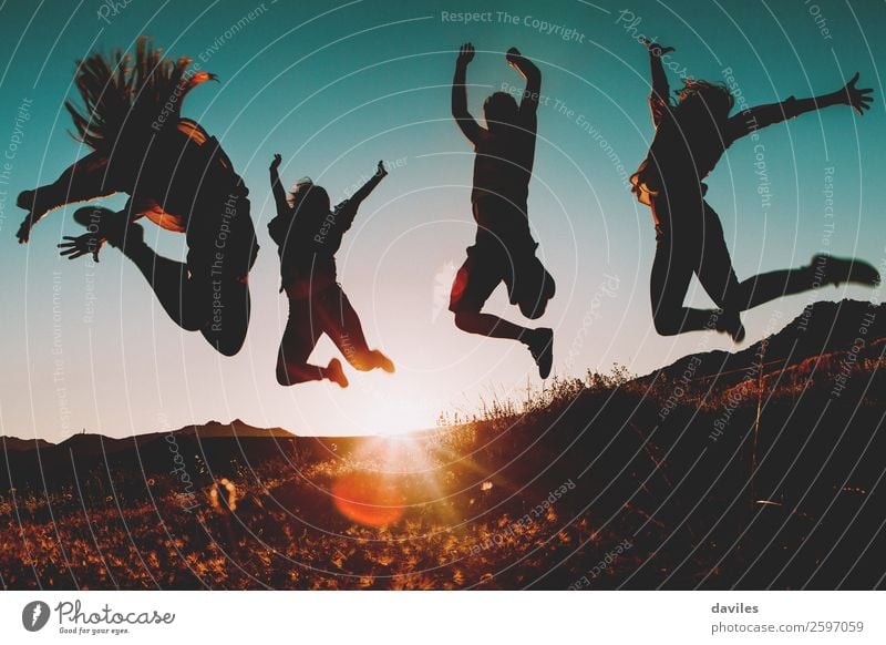 Four people jumping at sunset. Lifestyle Joy Vacation & Travel Trip Summer vacation Sun Hiking Human being Young woman Youth (Young adults) Young man Woman