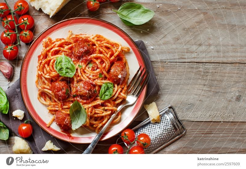 Pasta with tomato sauce and meatballs Meat Cheese Herbs and spices Lunch Dinner Plate Fork Table Fresh Gray Green Red Tradition pasta Basil Spaghetti Tomato