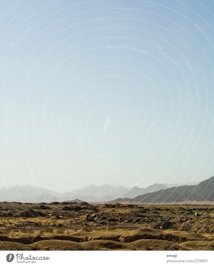 litter Environment Nature Landscape Sky Cloudless sky Warmth Drought Hill Rock Mountain Desert Dry Blue Far-off places Ground Earth Colour photo Exterior shot