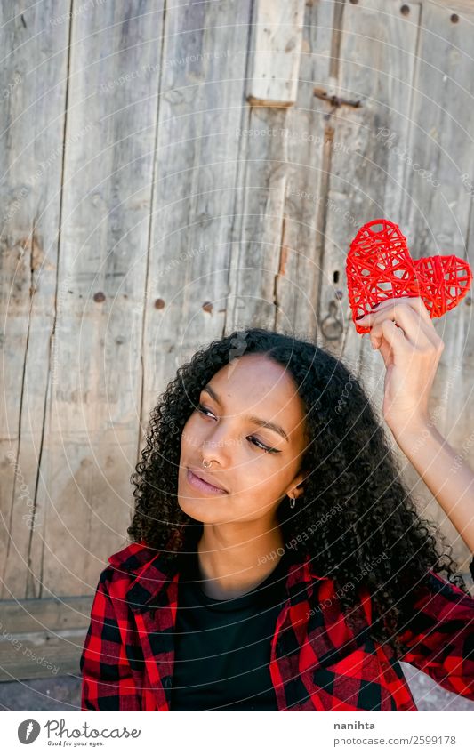 Beautiful young woman holding a red heart Lifestyle Style Joy Hair and hairstyles Human being Young woman Youth (Young adults) Woman Adults 1 18 - 30 years