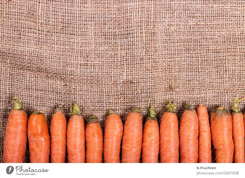 Fresh carrots Vegetable Nutrition Organic produce Garden Kitchen Autumn Sack Select Lie Sell Healthy Orange Row Carrot Root vegetable Vitamin Jute Vitamin A