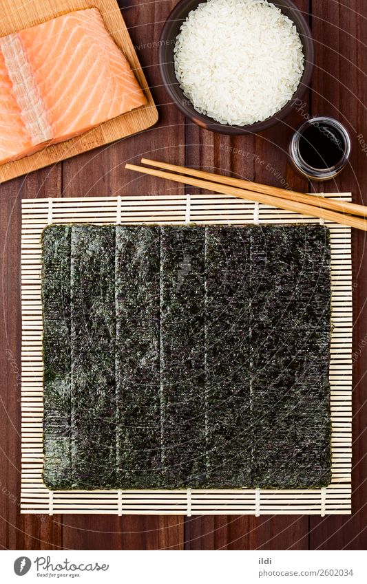 Sushi Ingredients Healthy food prepare preparing cooking nori Seaweed dry Dried makisu Mat bamboo mat Japanese Chopstick soy Sauce Rice Salmon fish sheet Asian