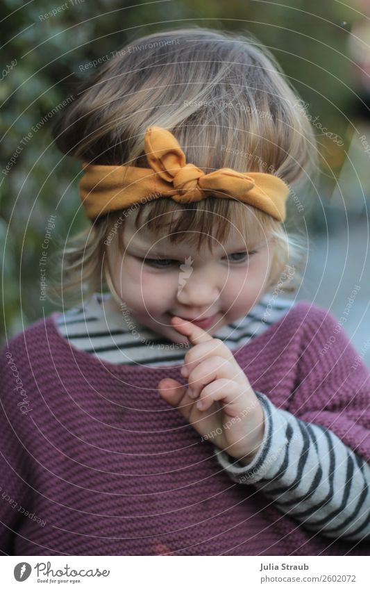 Girl with headband brooding Feminine Toddler girl 1 Human being 1 - 3 years Garden Sweater Knitted sweater Striped sweater Headband Bow brunette Blonde