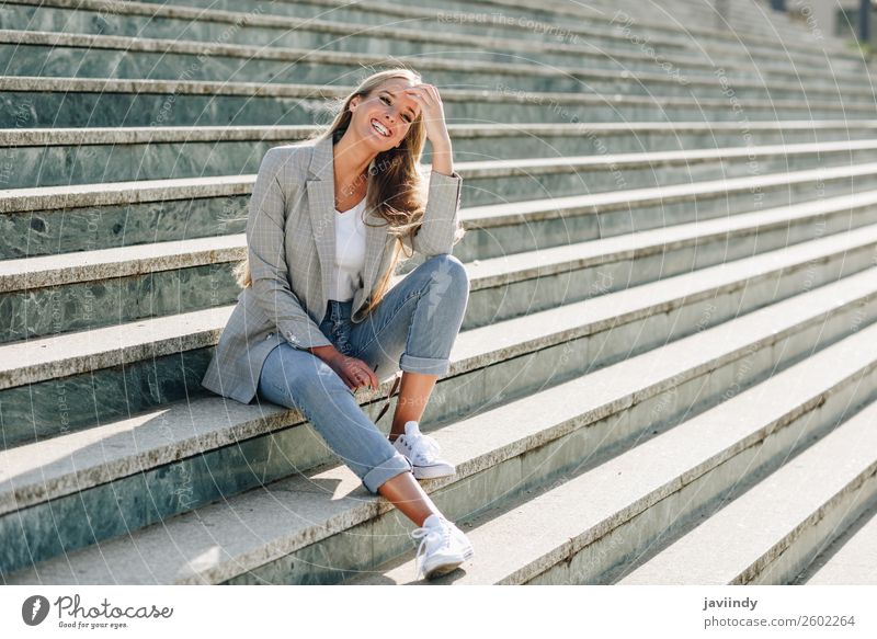 Blond Girl Wearing Casual Clothes In The Street Stock Photo