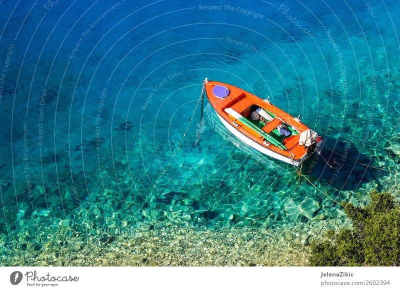 Red Fishing Boat in Turquoise Water with Blue Boat Cover, in