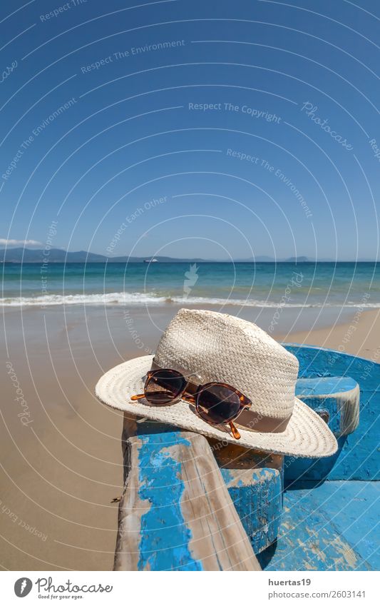 Hat and sunglasses on the beach Lifestyle Elegant Style Relaxation Vacation & Travel Tourism Adventure Beach Ocean Sports Sand Coast Hut Watercraft Sunglasses